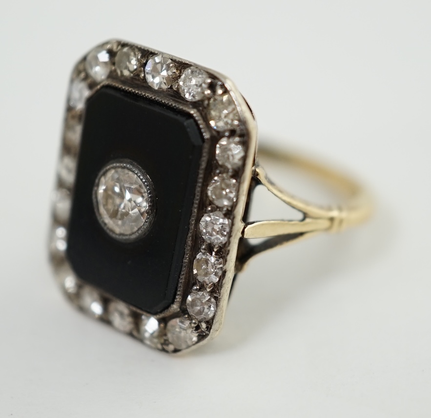 A 1940's? gold, black onyx and diamond cluster set tablet ring